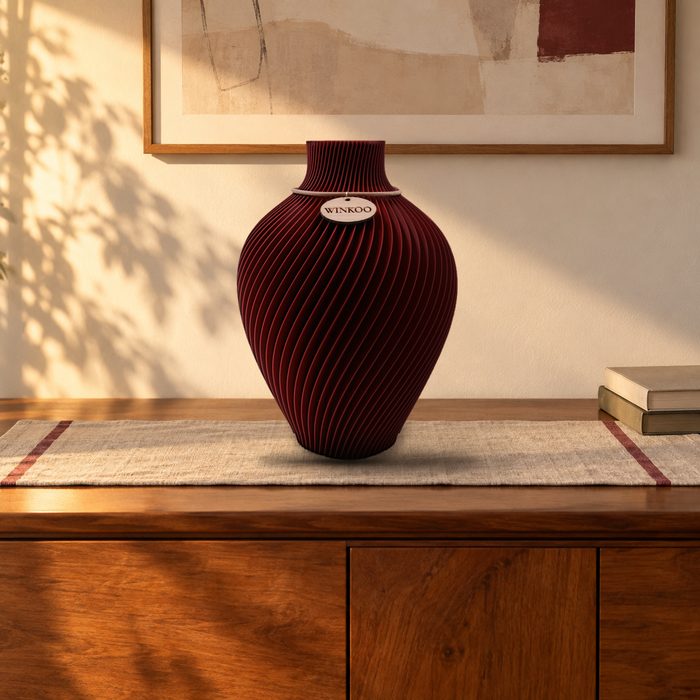 Noma vase in Maroon Red on a sideboard