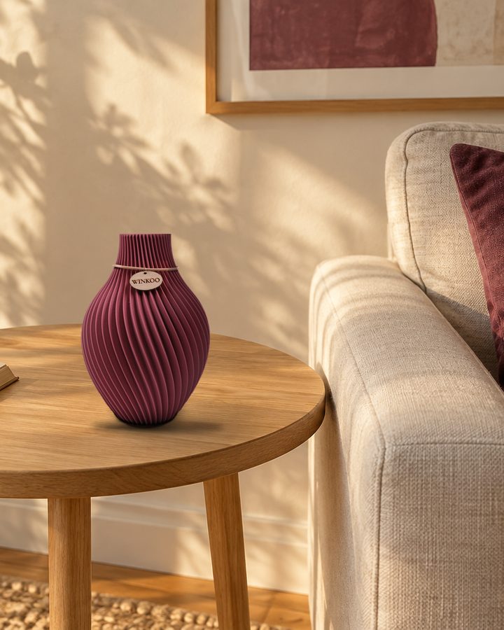 A Mulberry Orrin vase beside a sofa with a matching mulberry cushion and print