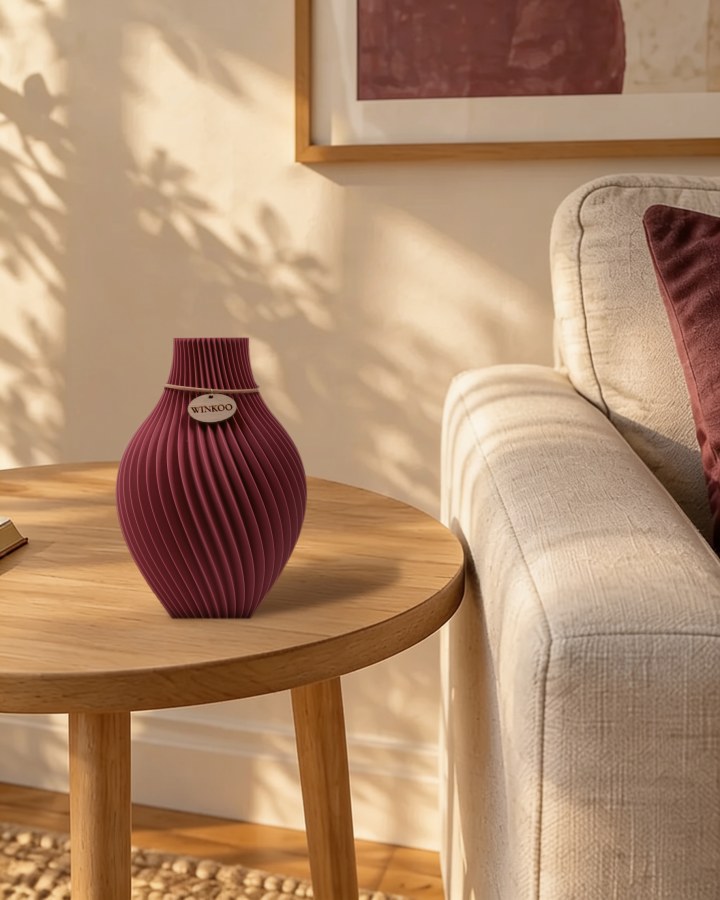 A Mulberry vase beside a sofa with a matching mulberry cushion and print
