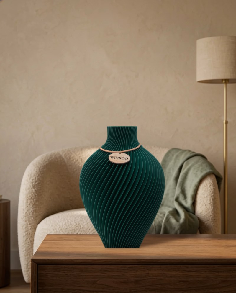 A Jade Green Noma vase on a timber console in a warm hotel lounge
